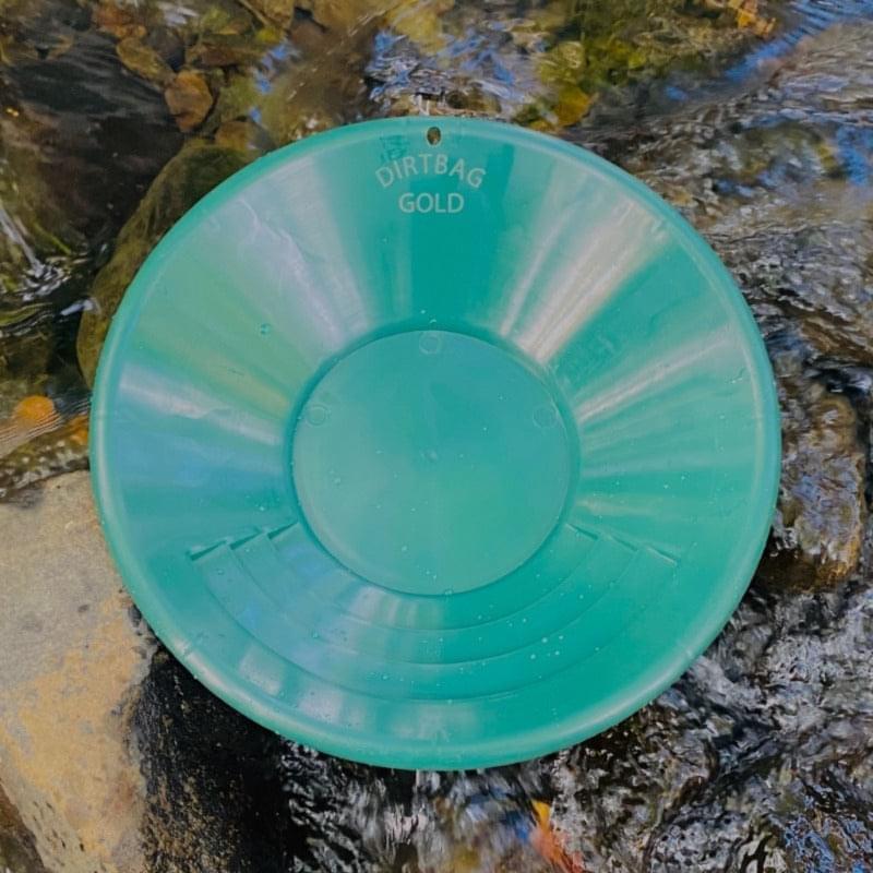 Uncover golden treasures with ease using this set of durable 10' and 14' inch gold pans, complete with clip holes for convenient storage and a contrasting green shade for effortless gold spotting